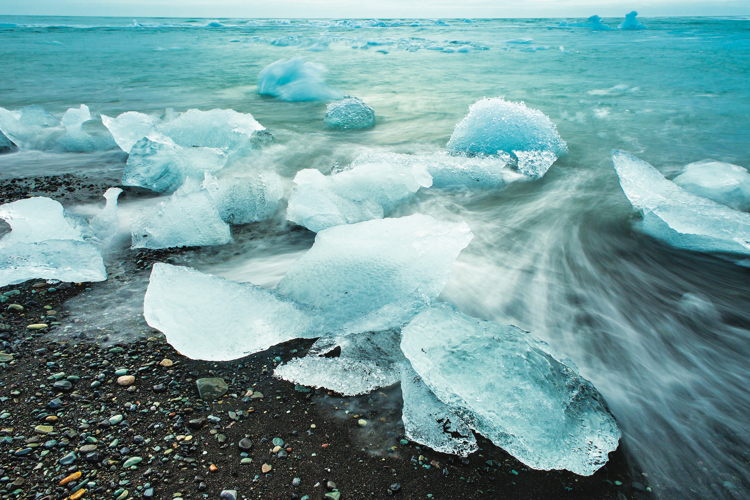 Breioamerkurjokull Iceberg bits on Black Sand Beach, Jokulsarlon, Vatnajökull National Park, Iceland