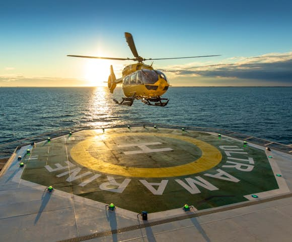 Helicopter landing on deck of Ultramarine Arctic vessel in Arctic