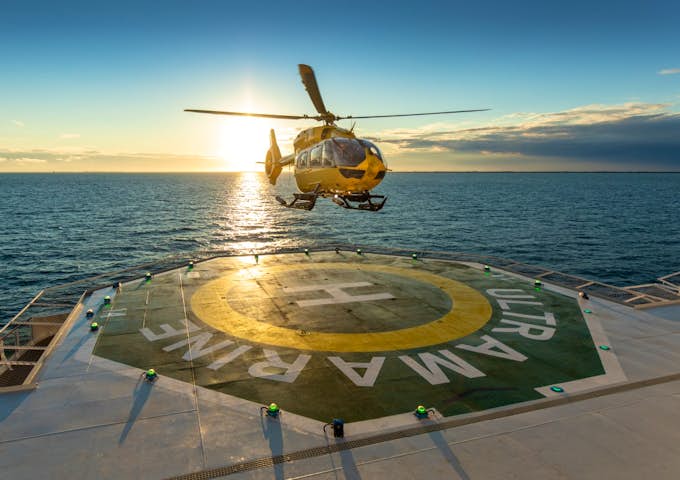 Helicopter landing on deck of Ultramarine Arctic vessel in Arctic