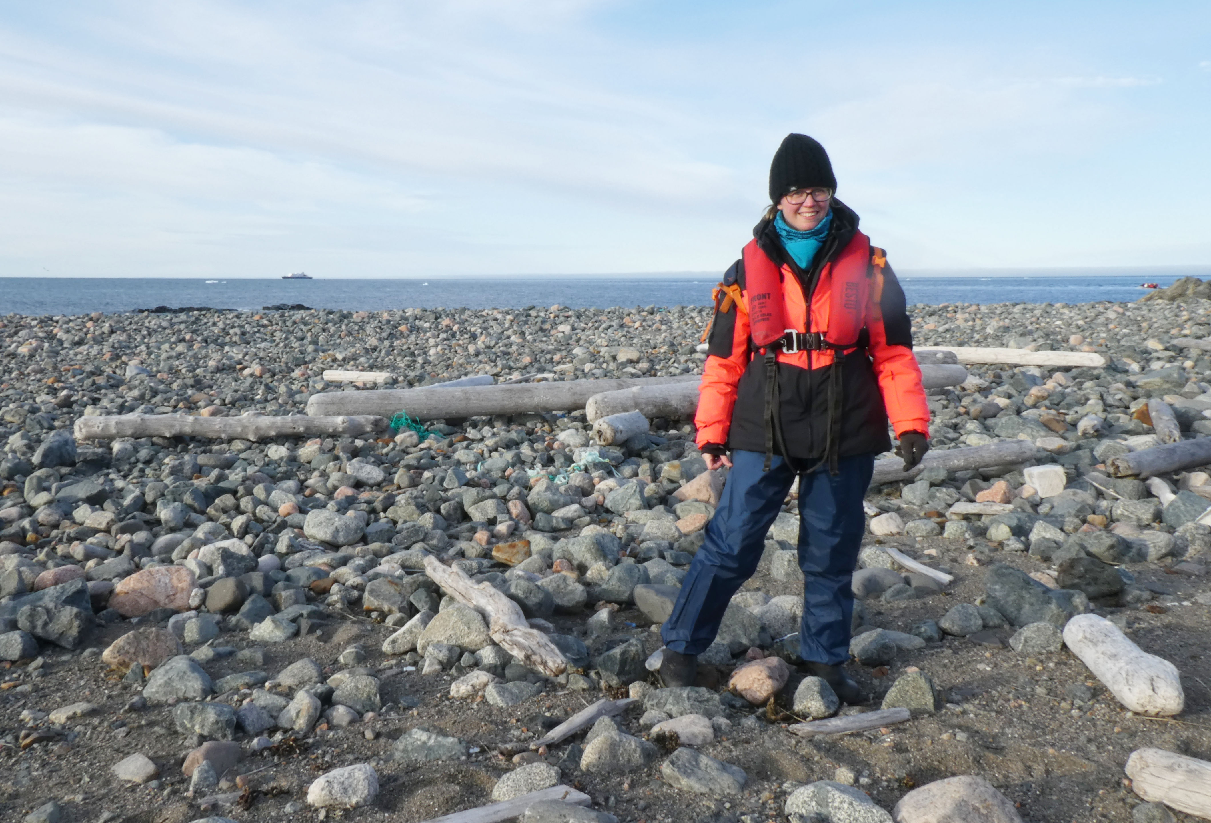 Hannah exploring a landing site in Svalbard