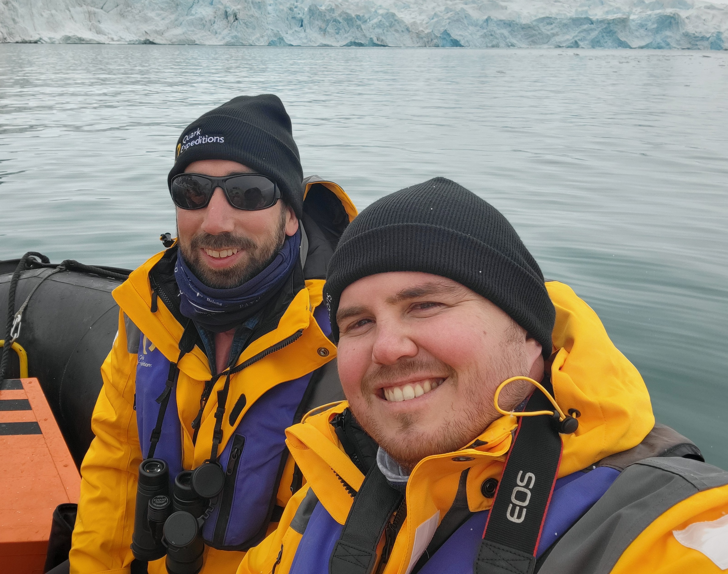 Swoop team members Nardus and Michael take a selfie while cruising on a zodiac in the Arctic