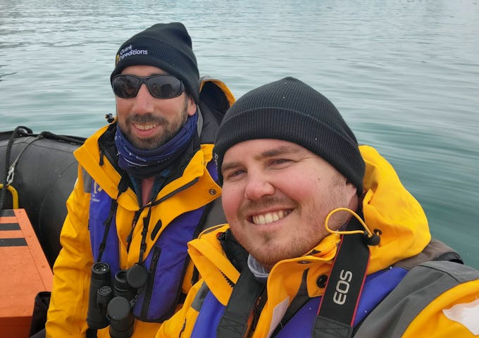 Swoop team members Nardus and Michael take a selfie while cruising on a zodiac in the Arctic