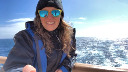 Woman in sunglasses sailing in Antarctica
