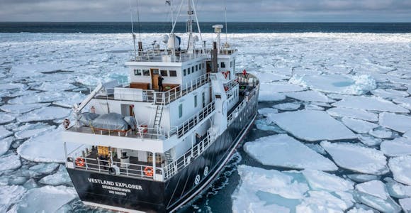 Explorer in ice near Svalbard